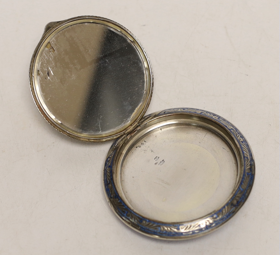 An early 20th century Austrian 935 sterling and enamelled circular compact, with fete gallant scene, 83mm, (a.f.).